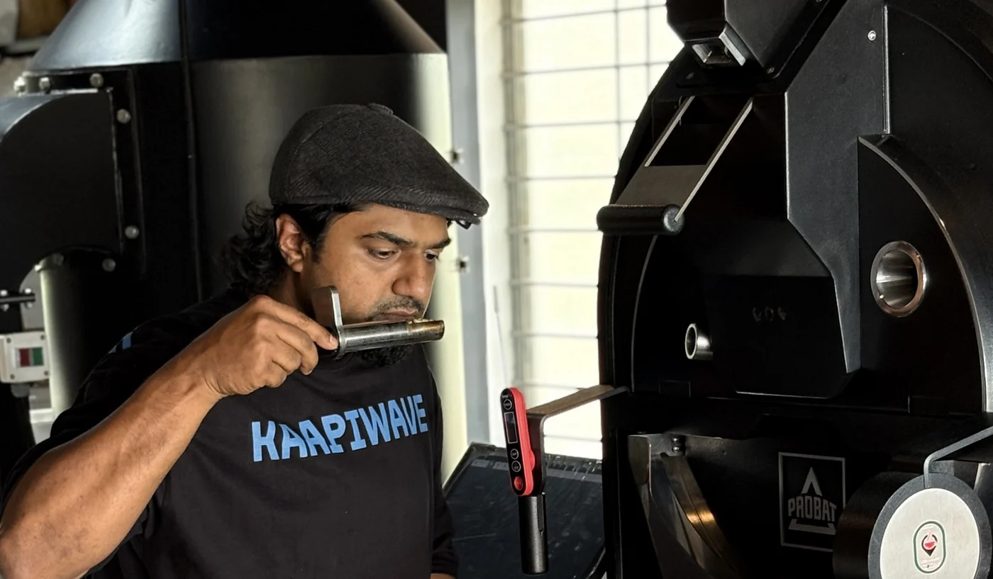Checking a roast sample from the trier
